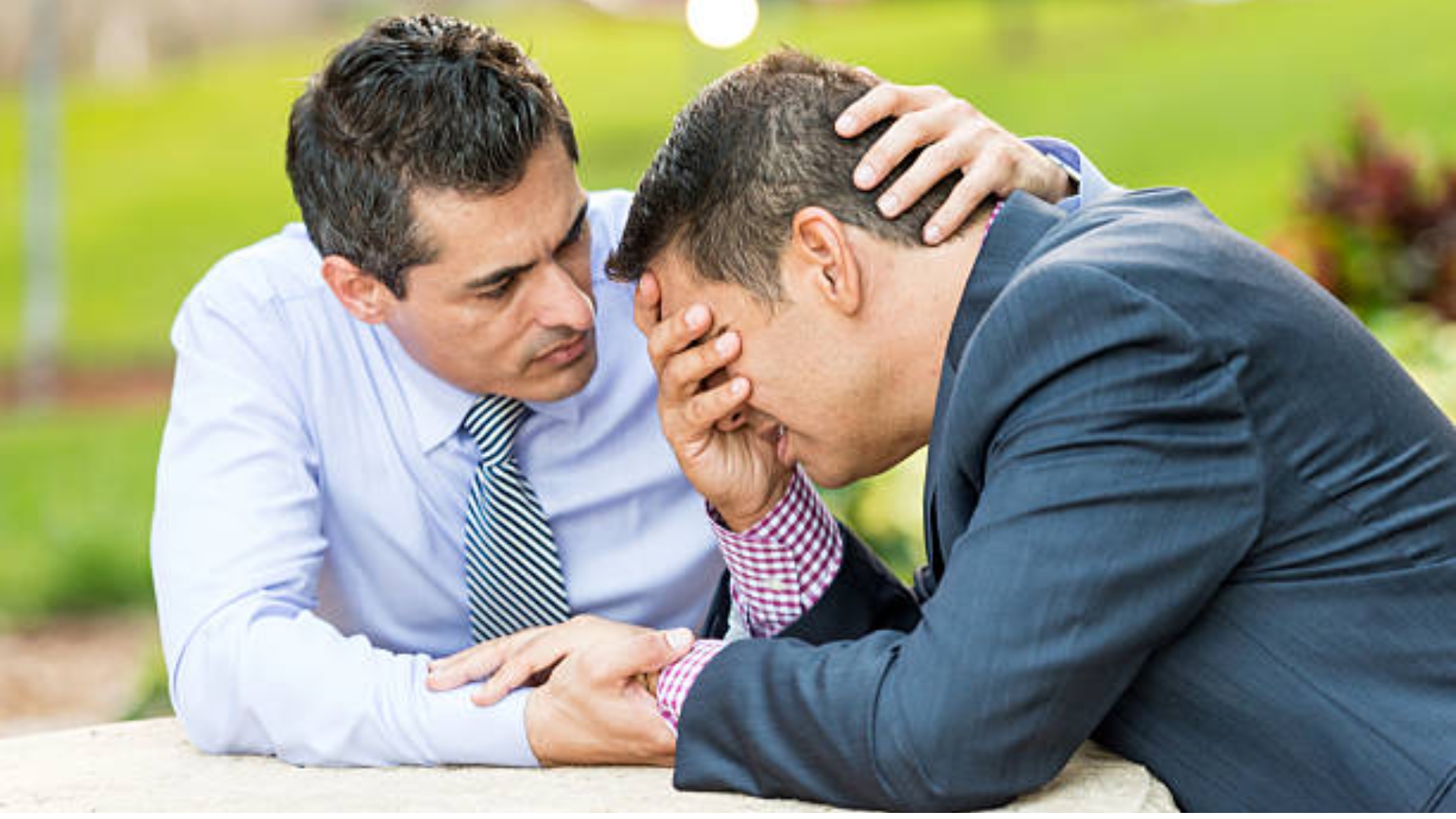 Men supporting each other through grief and loss with compassion, friendship, and emotional connection.