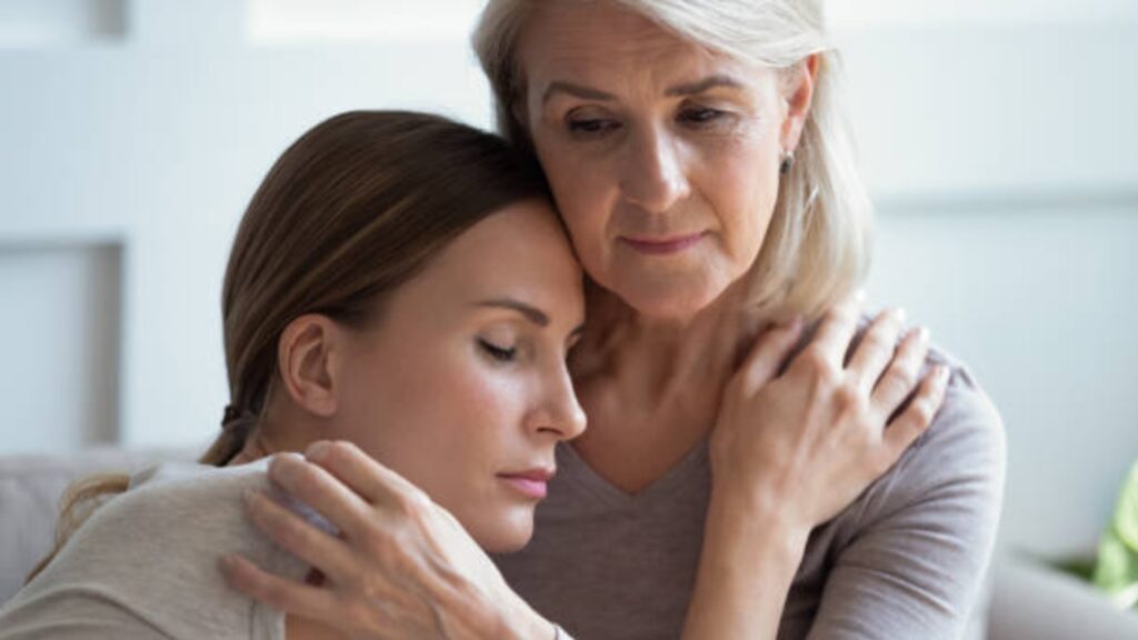 Adult child reconciling with a difficult parent through healthy boundaries and forgiveness